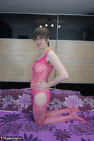 Hot Milf. Posing In A Pink Bodystocking Free Pic 1