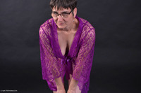 In a chic Negligee with matching Lingerie.Everything in the same color.An Outfit where I think it