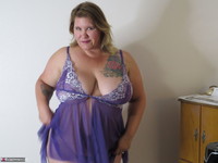 I have a new purple lingerie set, panties and top. I try it on and show it off to you. What do you think I think it look