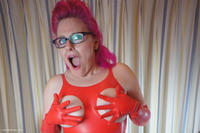 Check out Mollie in this red rubber dress with holes cut in it for her gorgeous tits to poke through.
